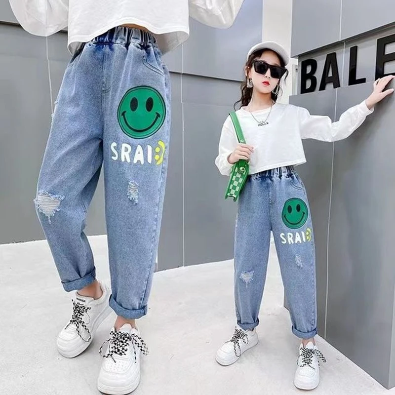 

New Girls Jeans Pants Spring and Autumn Casual Kids Cartoon Smile Design Kids Jeans Trousers Teen Children's Clothing 4-12 Years