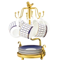 tea cups and saucers with golden stand