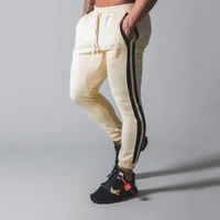 2022new gym fitness mens autumn sports wind mens casual trousers patchwork cotton fashion loose bundle feet elastic sweatpants