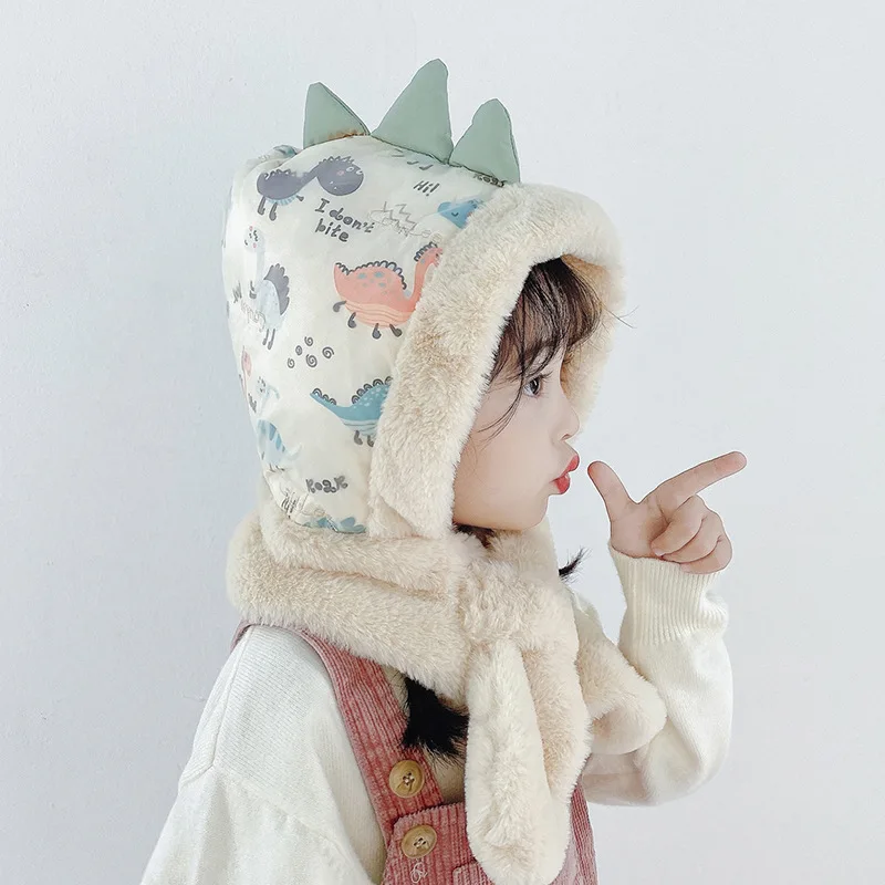 

Зимняя детская шапка, шарф в одном плюс, флисовые теплые шапки, ветрозащитные шапки с мультяшным динозавром для детей, шапка-ушанка для дево...