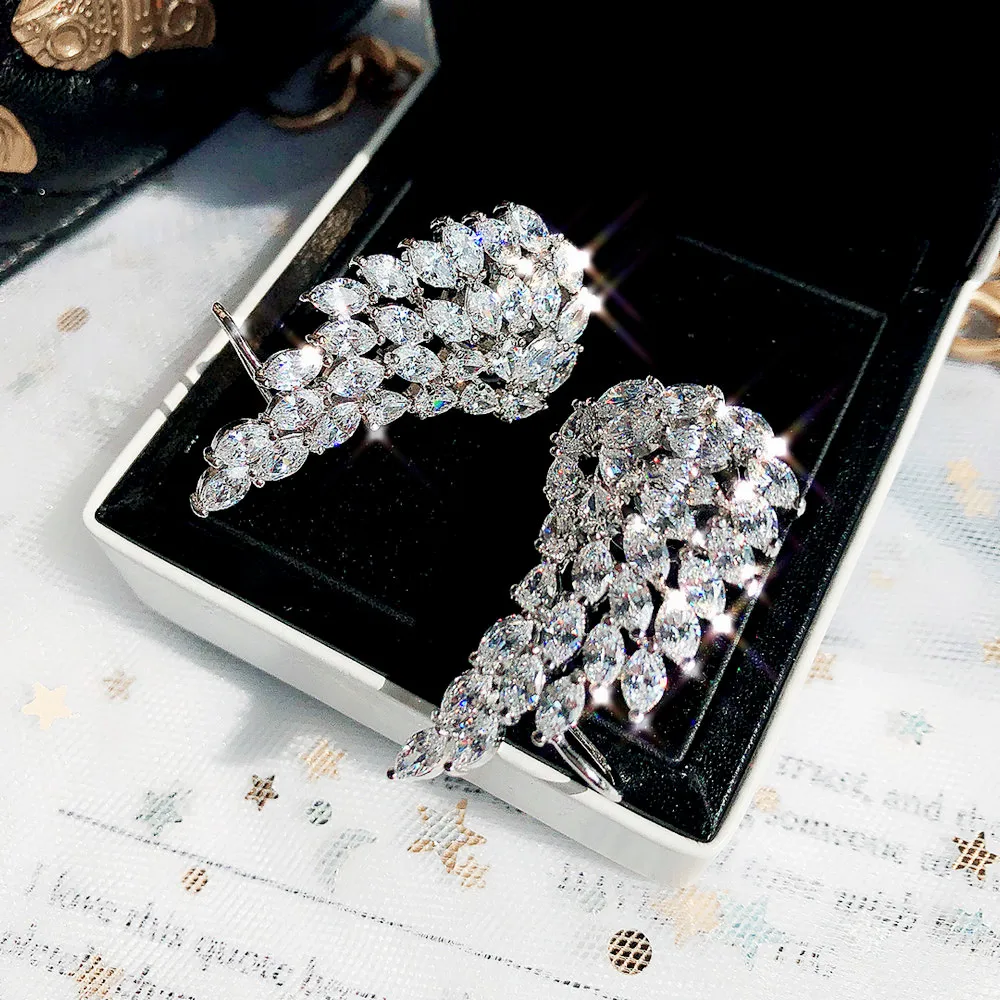 

Uilz Trendy Brilliant Cubic Zirconia Angel Wings Stud Earrings for Women Girls Fashion White Gold Color Wedding Jewelry UE419