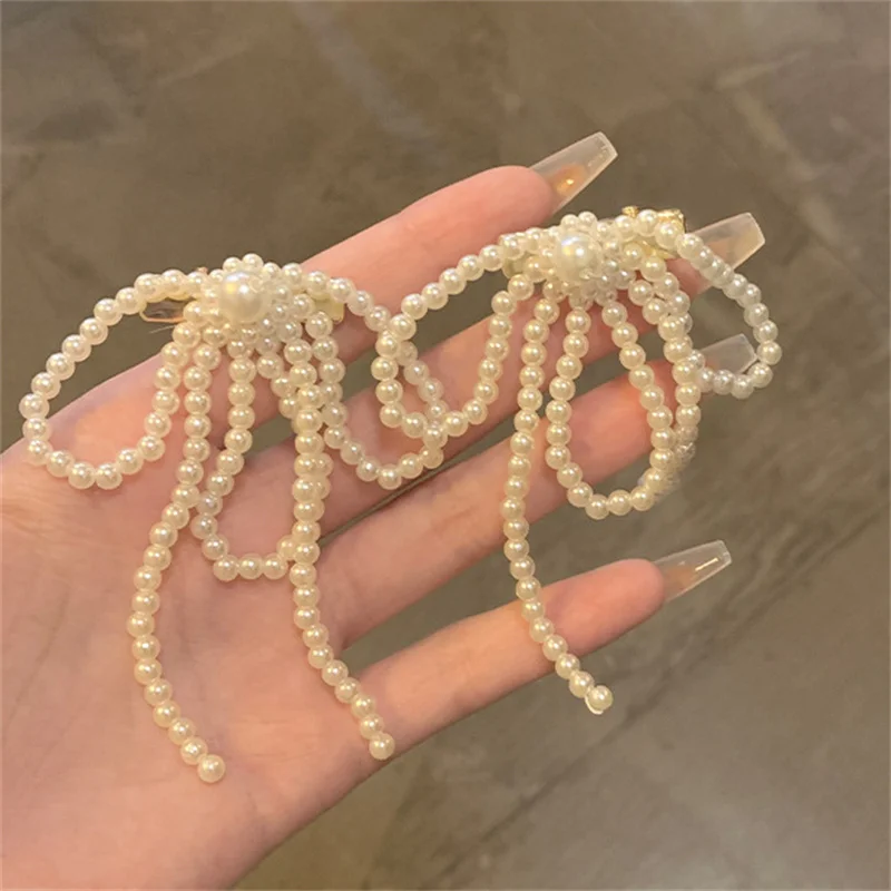 Заколка для волос с бантом из искусственного жемчуга и цветком текстура