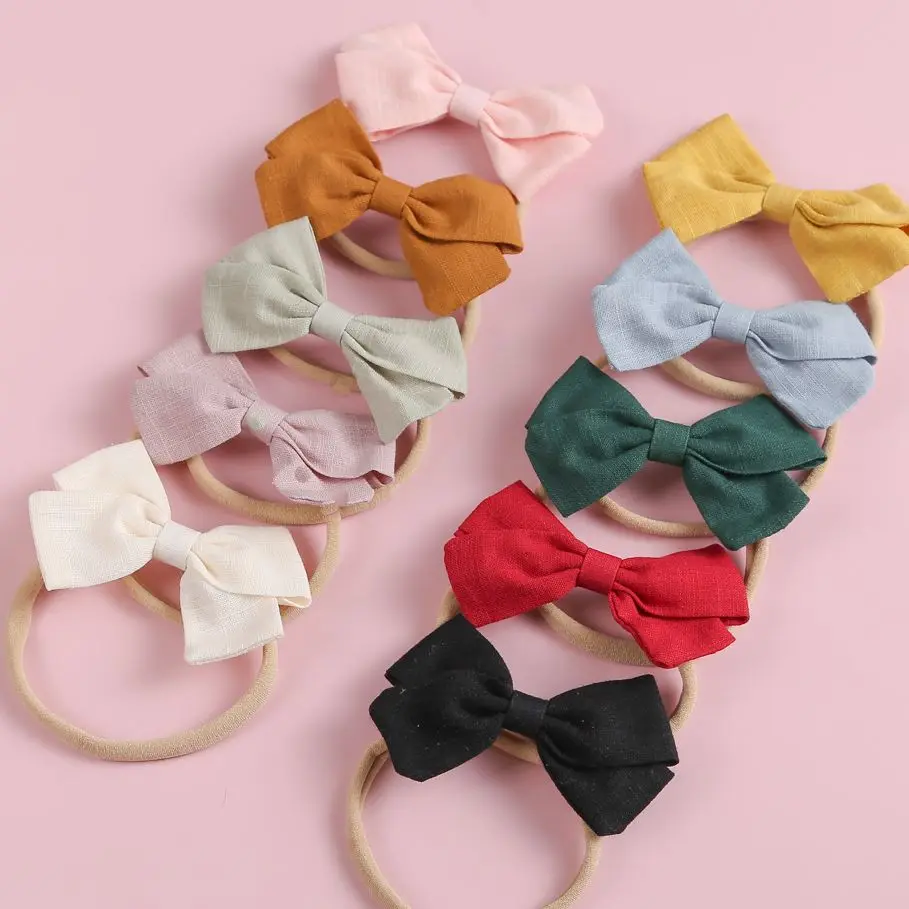 

Мягкая эластичная повязка на голову с бантом для девочек