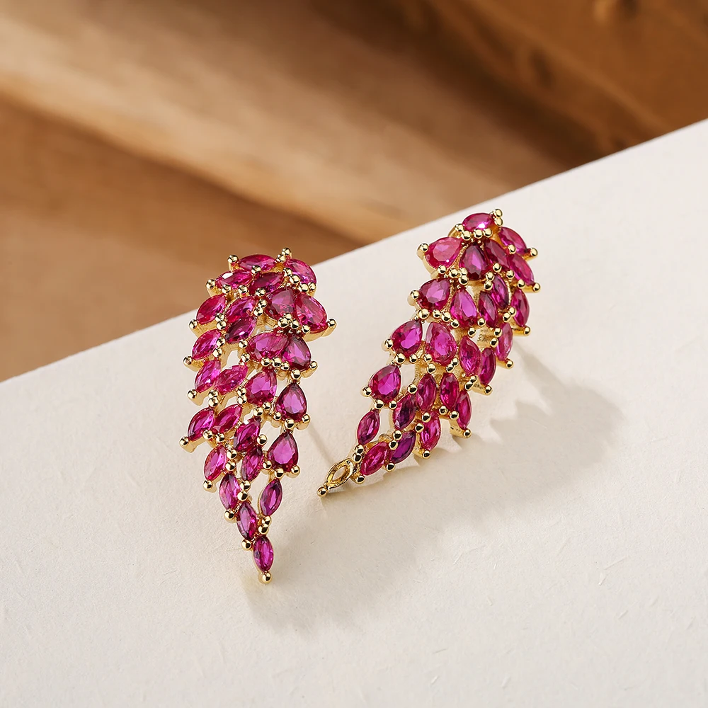 Серьги-подвески в виде листьев с фианитом