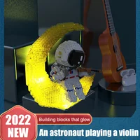 2022 Luminescent violin playing astronaut microparticle building blocks Astronaut Building blocks Puzzle set birthday gift toy