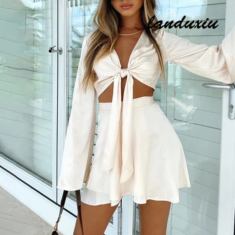 

Женский атласный комплект из двух предметов, Укороченный кардиган с длинными рукавами-фонариками, топы, пикантная мини-юбка с запахом на шн...