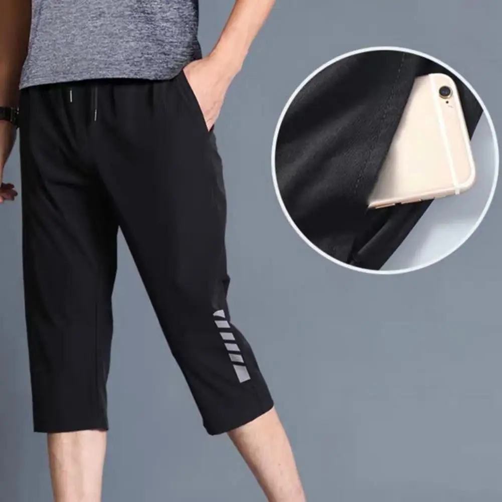 

Stylish Cropped Pants Elastic Waistband Men Drawstring Pockets Cropped Trousers Polyester 3/4 Capri Pants for Jogging