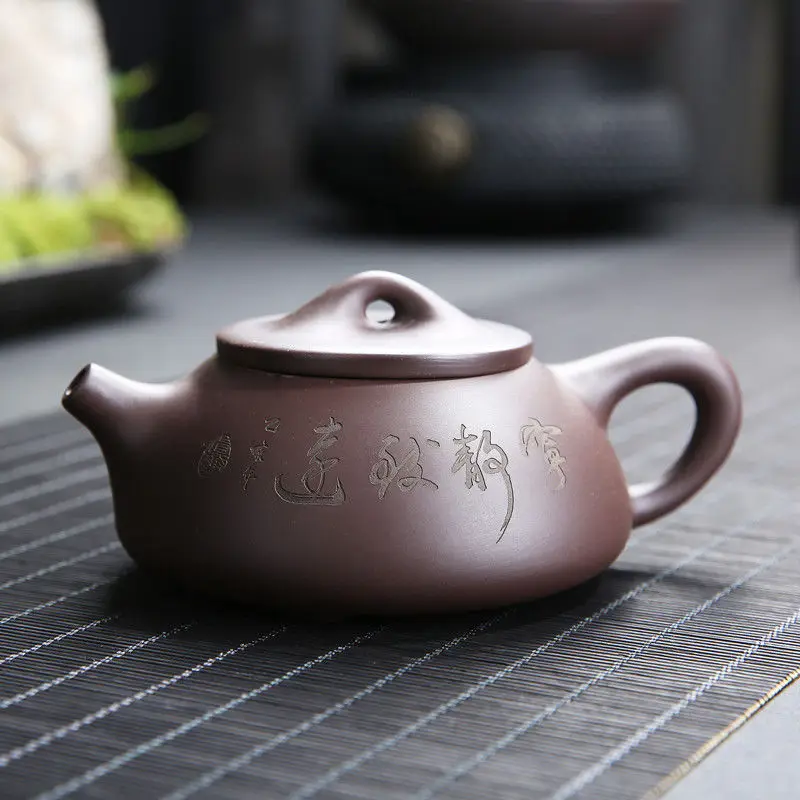 

Purple clay pot is purely handmade. It's an authentic Xishi pot. Kung Fu tea set. It's a small household teapot