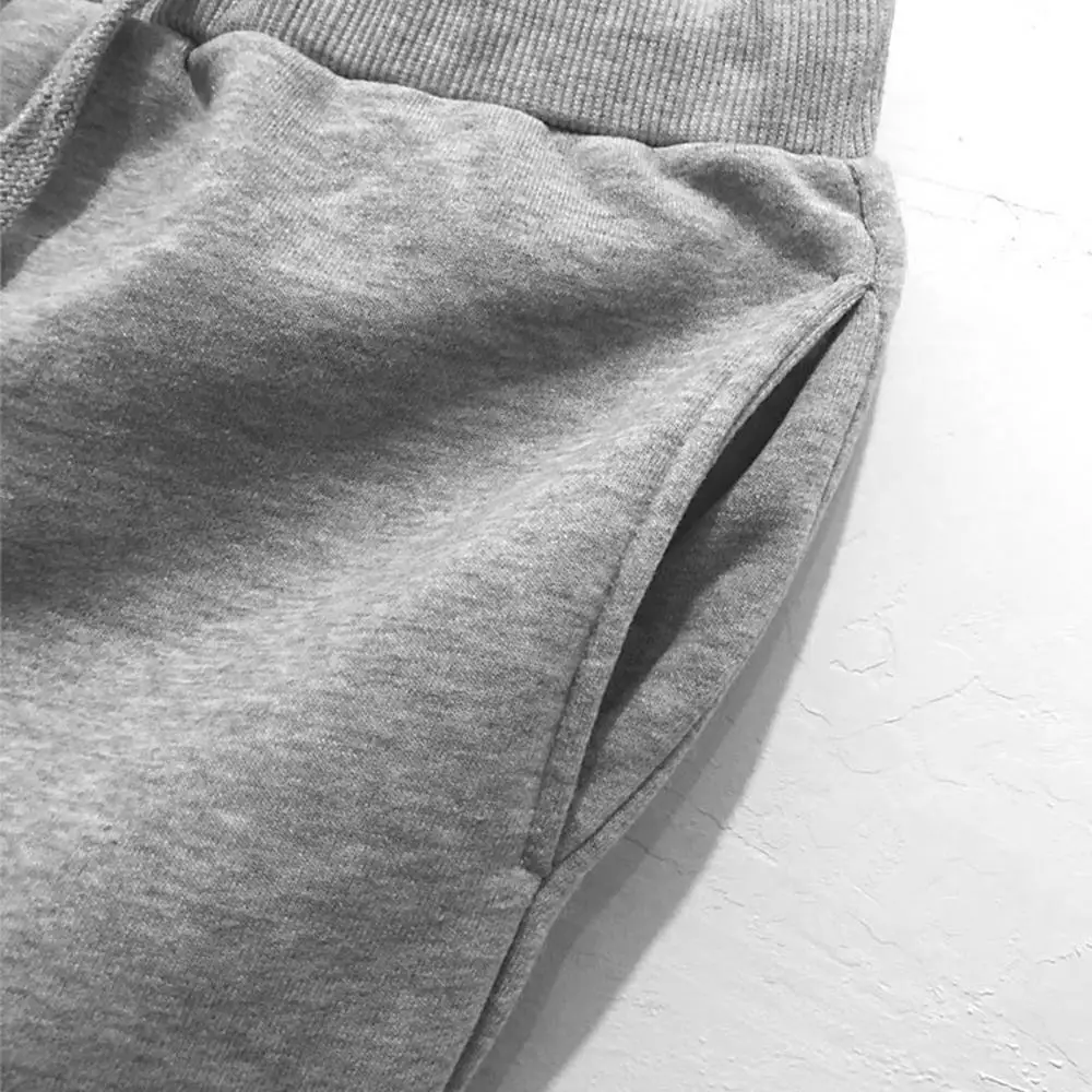 

Men's autumn and winter solid color drawstring two-pocket ankle strap flexible non-tight bandage pants sports pants