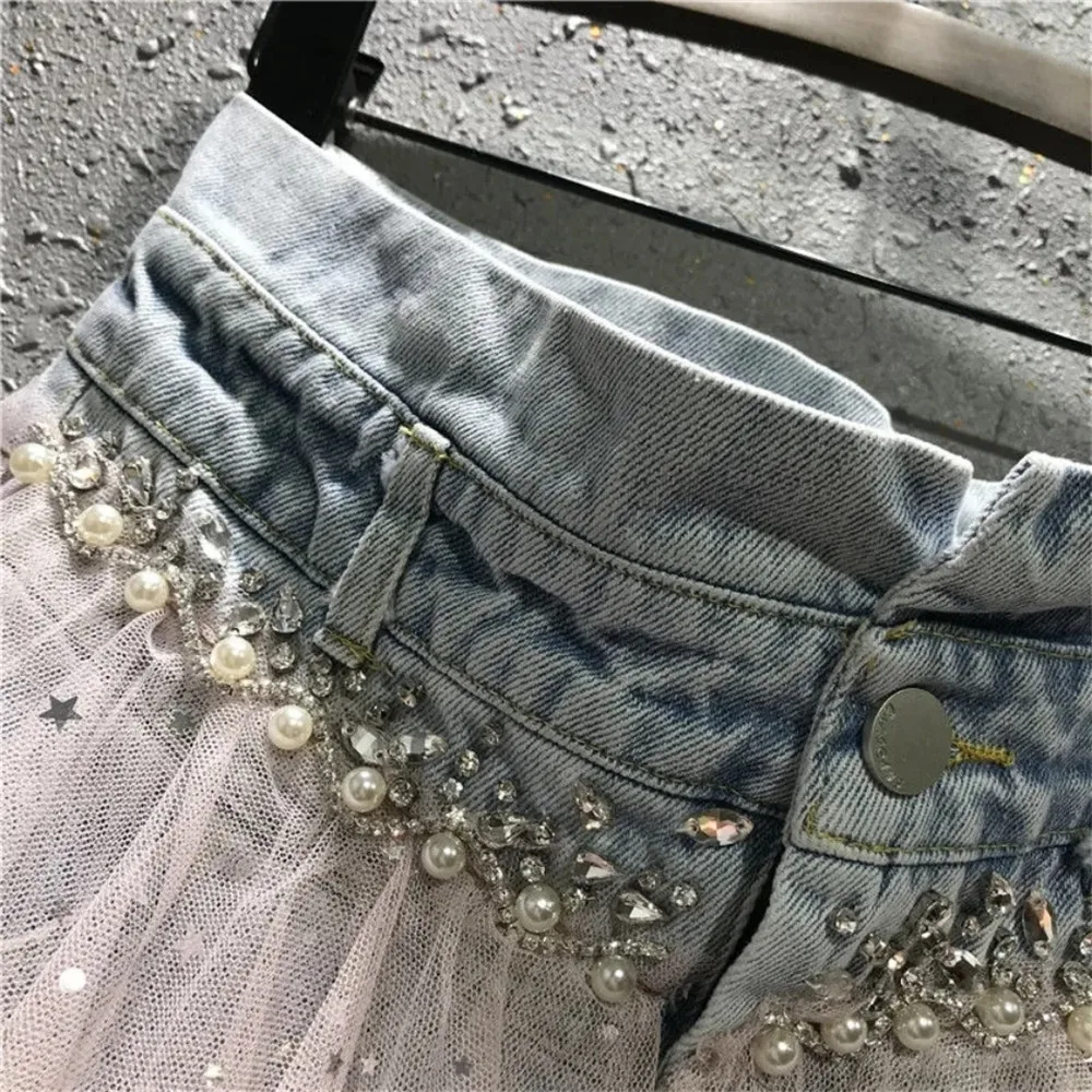 Женская короткая джинсовая юбка асимметричная сетчатая с блестками и бахромой