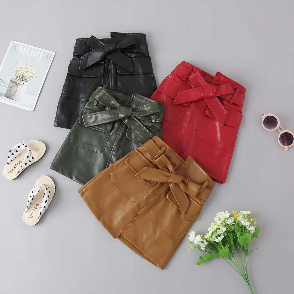 

Autumn And Winter Girls Skirt Solid Color Fashion A Word Irregular Bow Belt Princess PU Leather Skirt Quality Girls Warm Clothes