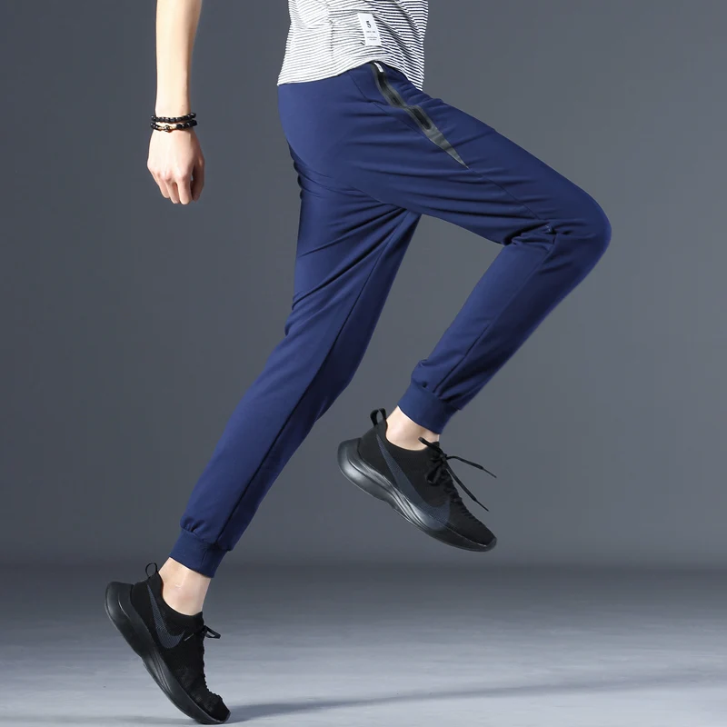 

Spring and Autumn sports clothing men's casual trousers draw rope elastic straight trousers solid color loose jogger sweatpants