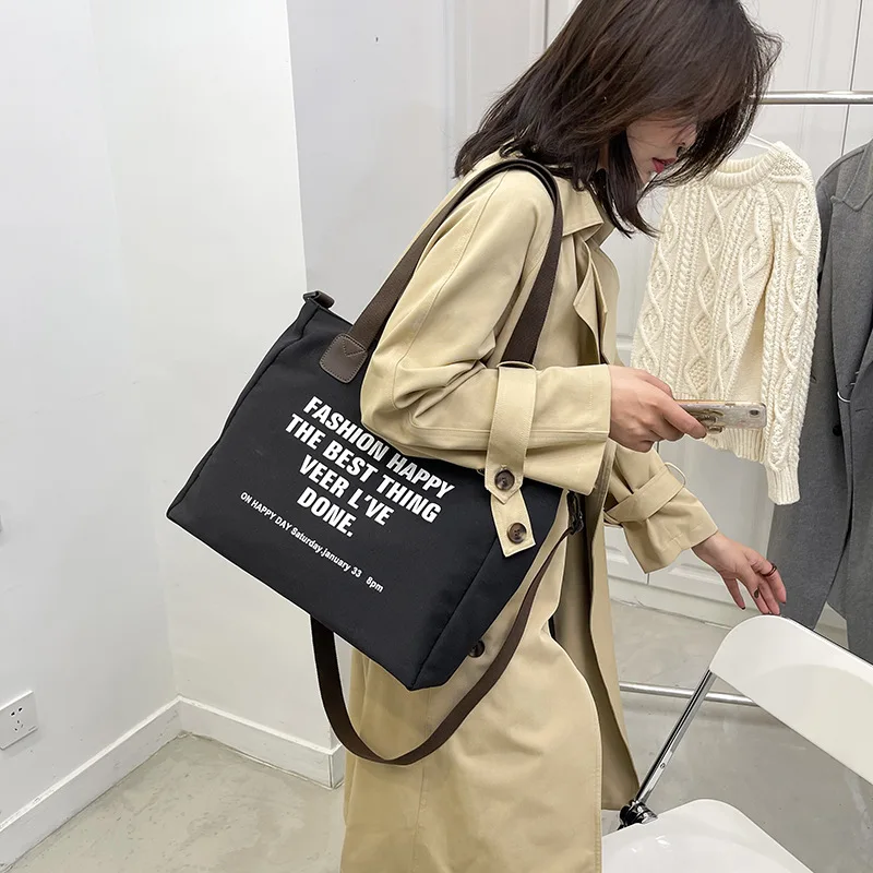 

Simple canvas large capacity shopping bag bag women 2021 new lazy style one shoulder fashion Japanese messenger bag trend