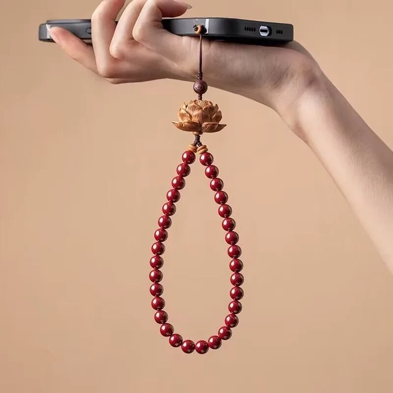 

Chinese style creative cinnabar mobile phone chain pendant Purple gold sand peach wood lotus flower anti loss pendant