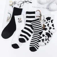 5 pairs autumn and winter ins wind new cow socks women in tube black and white cartoon sports cotton socks