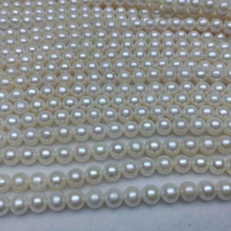 

Fine round near 8mm white freshwater pearl strands lots 5 strings