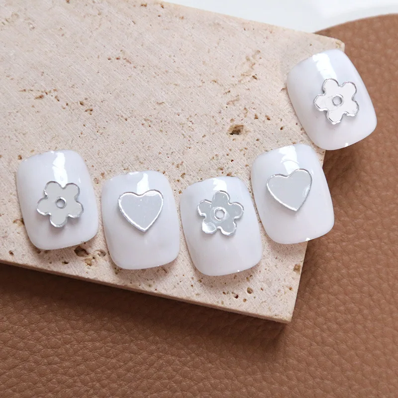 

50Pcs Mirror Face White Flower Nail Charm 5-Petals Flower,Heart Shaped Design Small Silver Nail Art Glitter Accessories 8*8MM