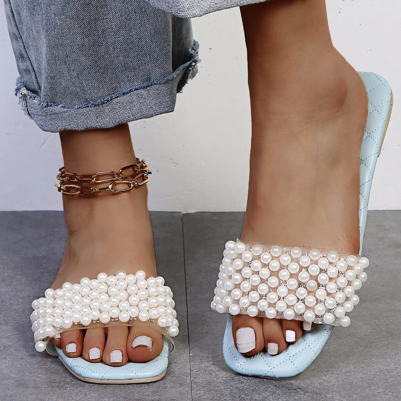 

Шлепанцы женские из экокожи, повседневные сандалии с жемчугом, дизайнерская обувь на плоской подошве, пляжные классические тапочки, сланцы,...