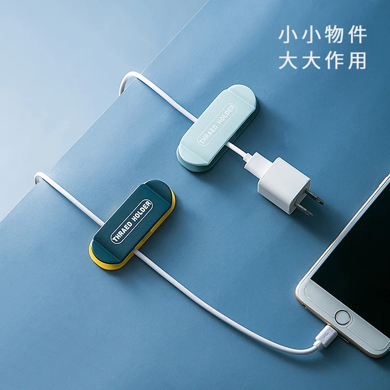 

Non-marking plug holder wall-mounted plastic cable organizer household creative wire storage artifact socket hook