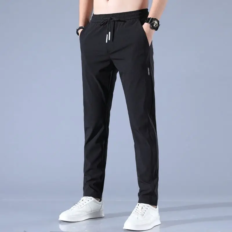 Pantalones elásticos de secado rápido para hombres Men Fast Dry Stretch Pants Ice Silk Trousers Solid Color Mid-Waist Loose Pant images - 6