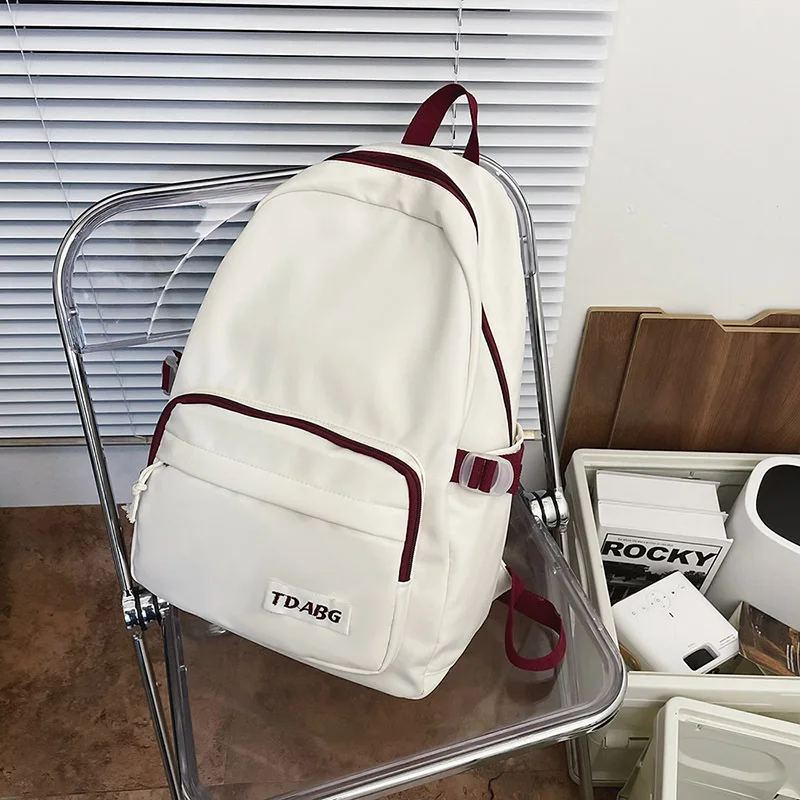 

Big capacity fashion breathable waterproof wear-resistant load-reducing school bag solid color Korean version student backpack