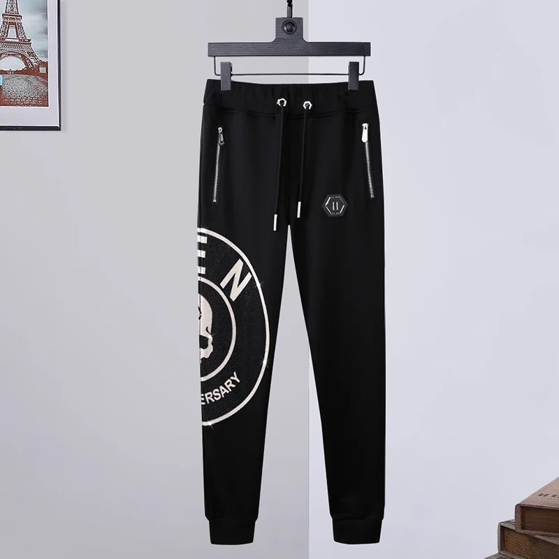 

Sweatpants men's side skull hot drilling long trousers pp sweatpants small feet fashion slim plein 78 trousers Europe station