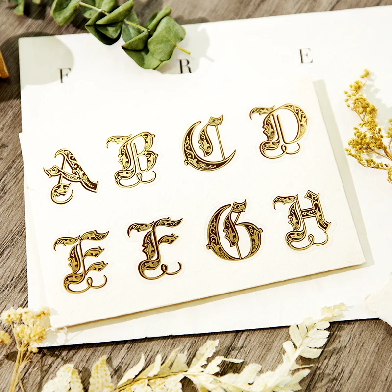 

52 PCS PET Stickers Gilded English letters retro collage base account Scrapbooking Stickers classical a capital letter 6 styles