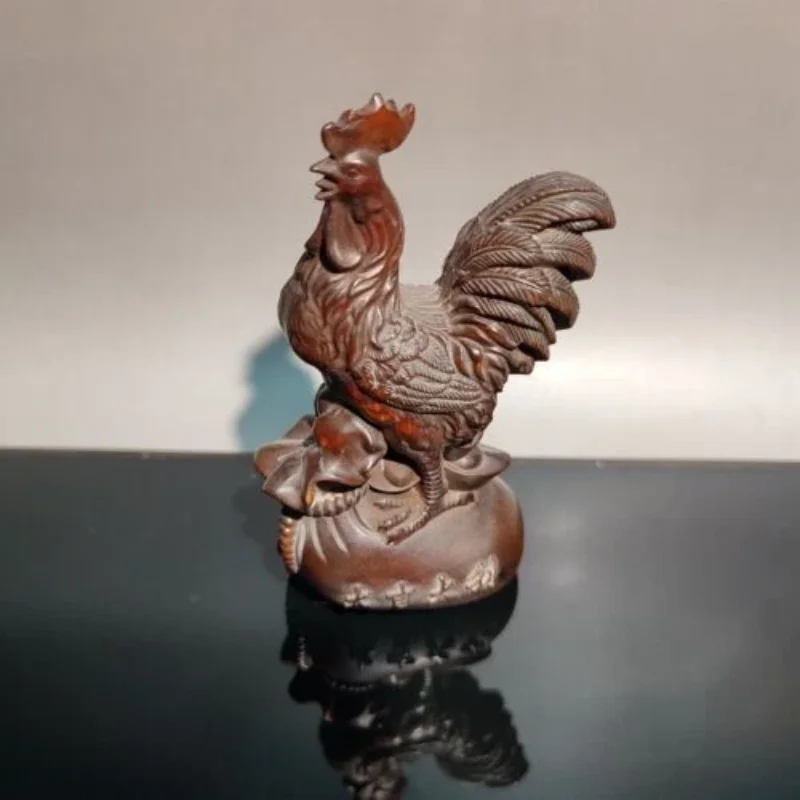 

Деревянная статуэтка петуха