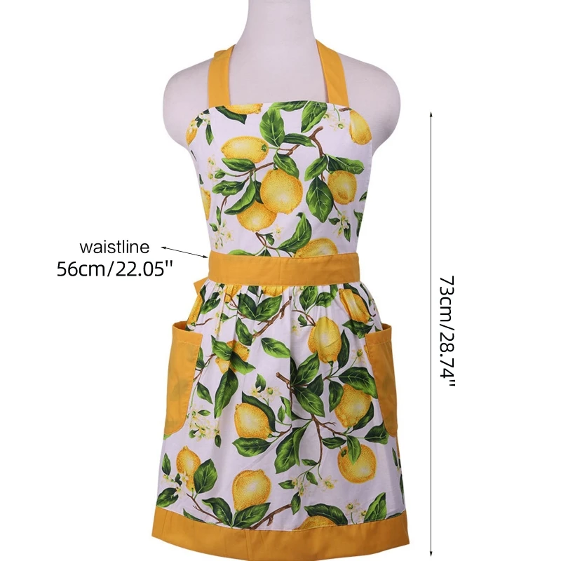 Кухонный фартук с зелеными листьями и лимоном карманами без рукавов висящий на