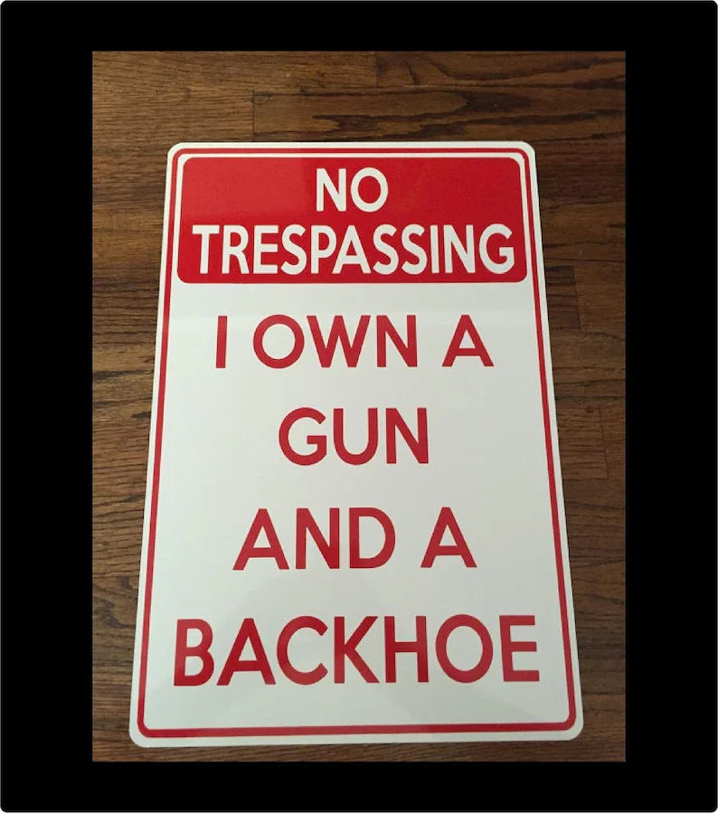 

No Trespassing- I own a gun- 12"x18" White Aluminum sign