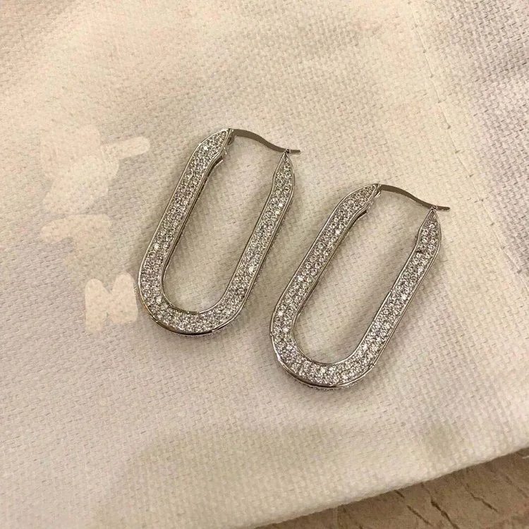 

Серьги-гвоздики женские эллиптические U-образные с фианитами