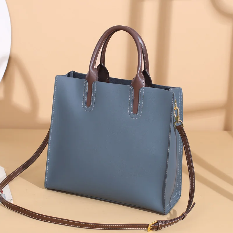 2023 new crossbody single shoulder large capacity handbag female leather commuter girls senior sense of cowhide tote bag