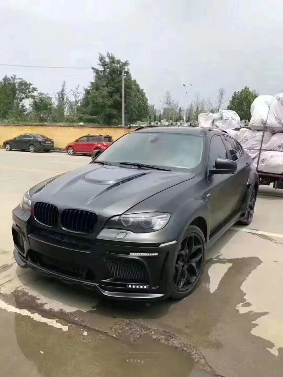 Фото Комплект расширения кузова из материала FRP для BMW X6 в стиле HAMANN: расширители колесных арок, боковые пороги. Поддержка индивидуальной настройки. №4
