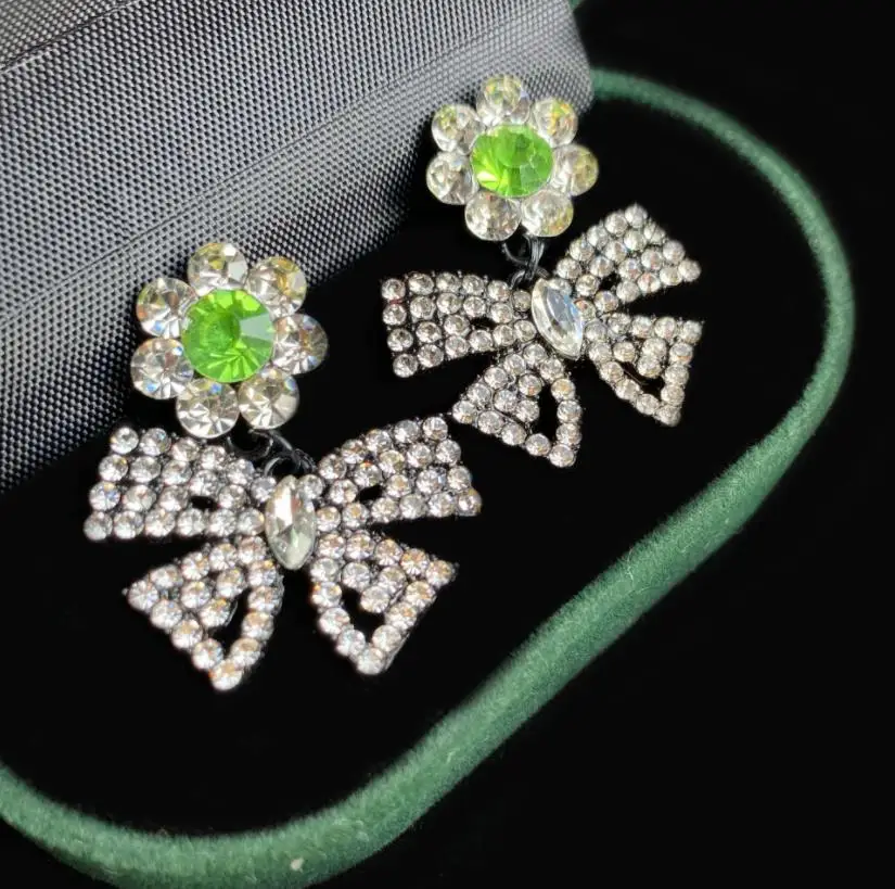 

Korean green diamond-studded flower bow earrings exaggerated designer sun flower sweet girl chic ear jewelry