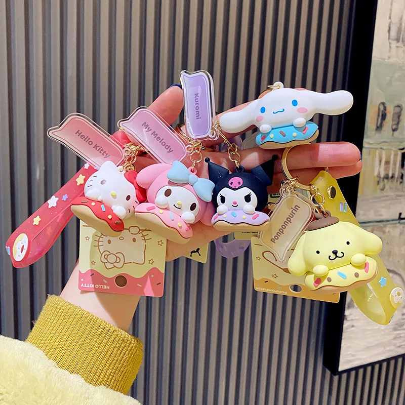 

Sanrio Anime Figure Hello Kitty Kuromi My Melody Peripheral Kawaii Figurine Doughnut Bag Decor Keychain Doll Toys Children Gift