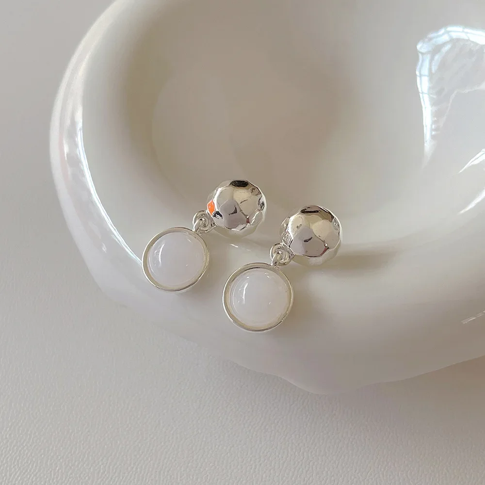 Нишевые дизайнерские круглые металлические серьги-подвески женские из серебра