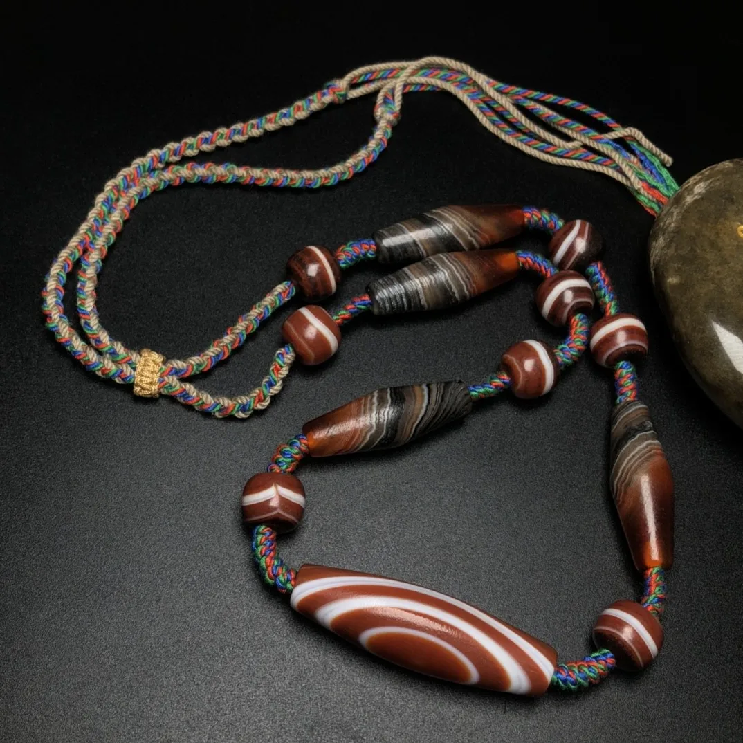 Тибетские бусины дзи в шелковой обертке из овечьих глаз агат ключица лизо колье