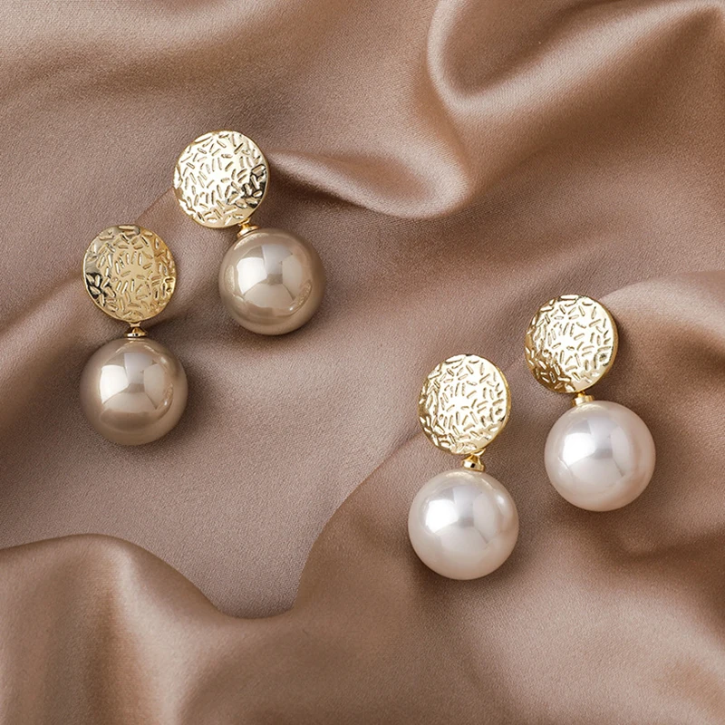 

Korean Version Temperament Net Red Metal Fashion Champagne Pearl Earrings For Women Simple Cold Wind Earrings 2022 New