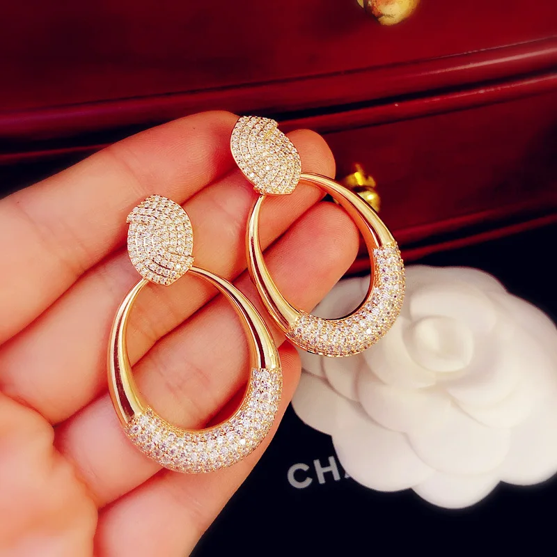 

European and American 925 silver needle hollow oval large water drop zircon temperament high-end fashion simple round earrings