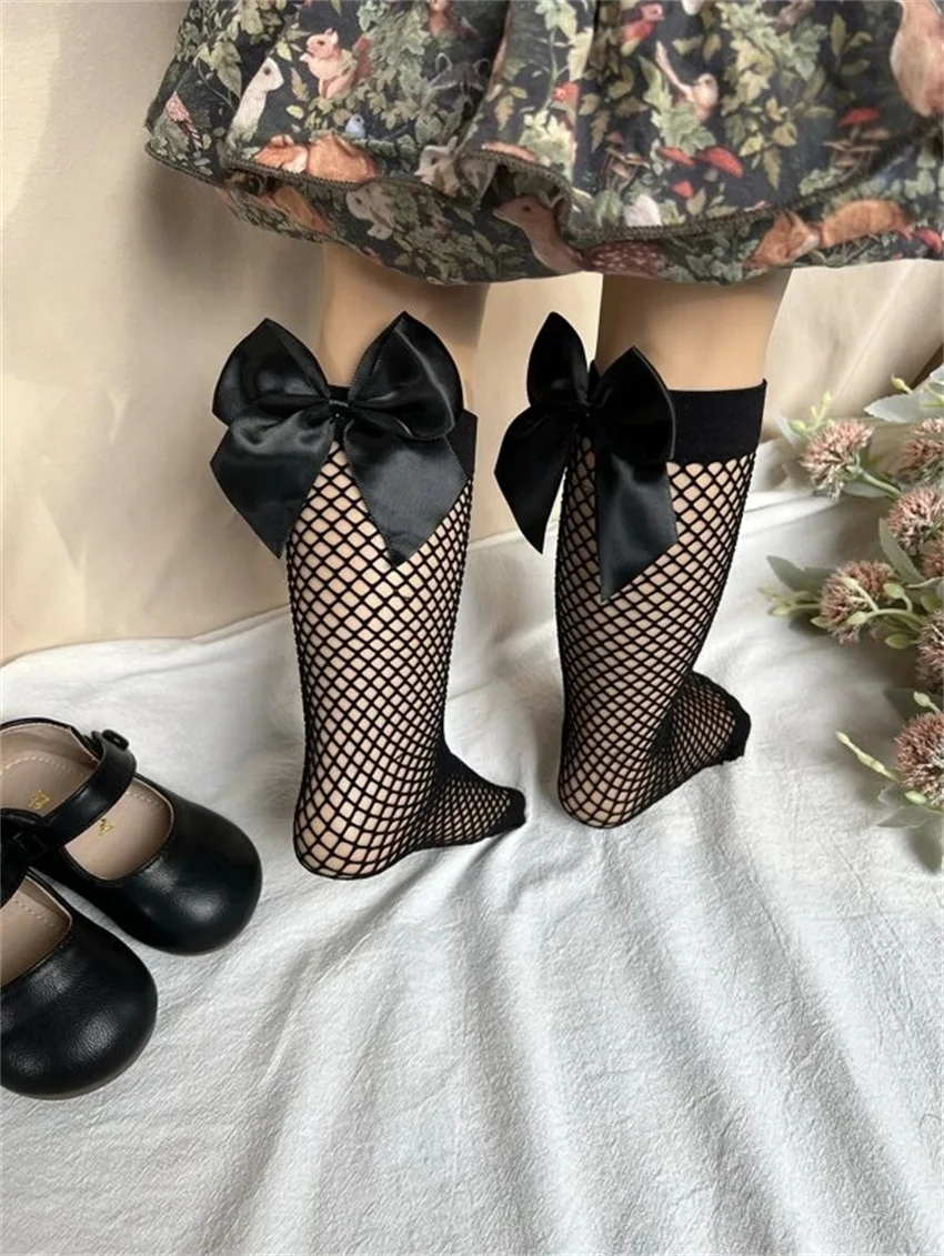 Рисунок 6 - Чулки в сеточку для девочек с бантом