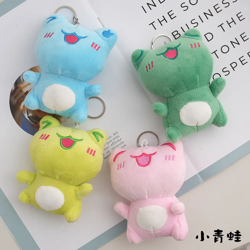 

Брелок для ключей с рисунком уродливого улыбающегося лица, зеленой лягушки