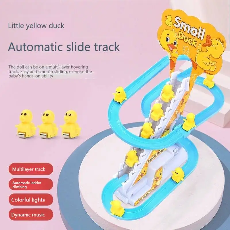

Little duck climbs stairs to assemble automatic track little yellow duck slides music boys and girls toy color box