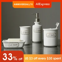 bathroom accessories set with soap or lotion dispenser toothbrush holder tumbler and soap dish white matt ceramic material