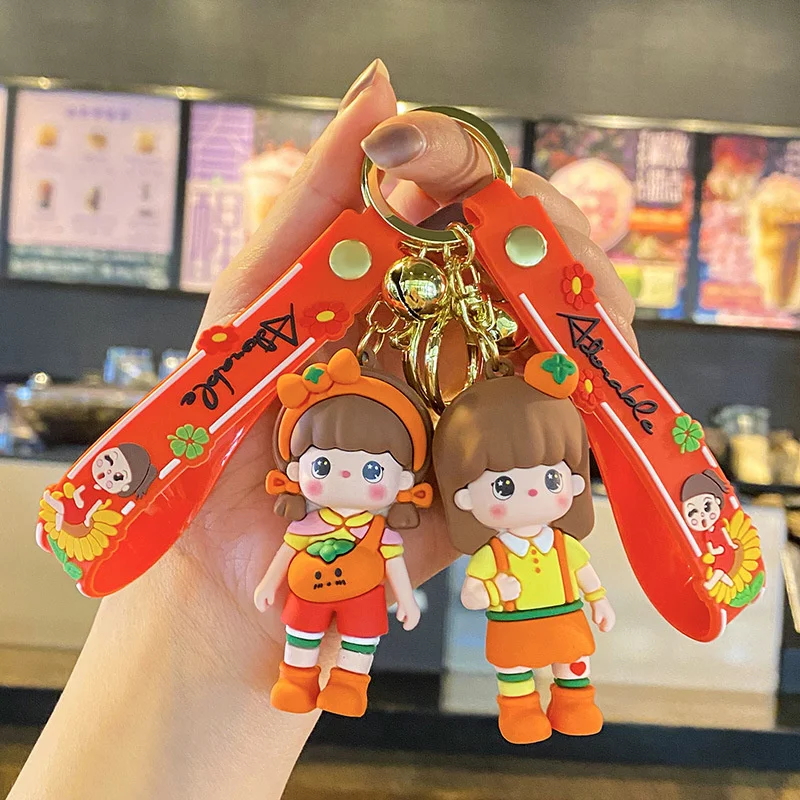

New creative sweet orange girl keychain pendant cartoon doll small gift car key accessories cute bag ornaments wholesale