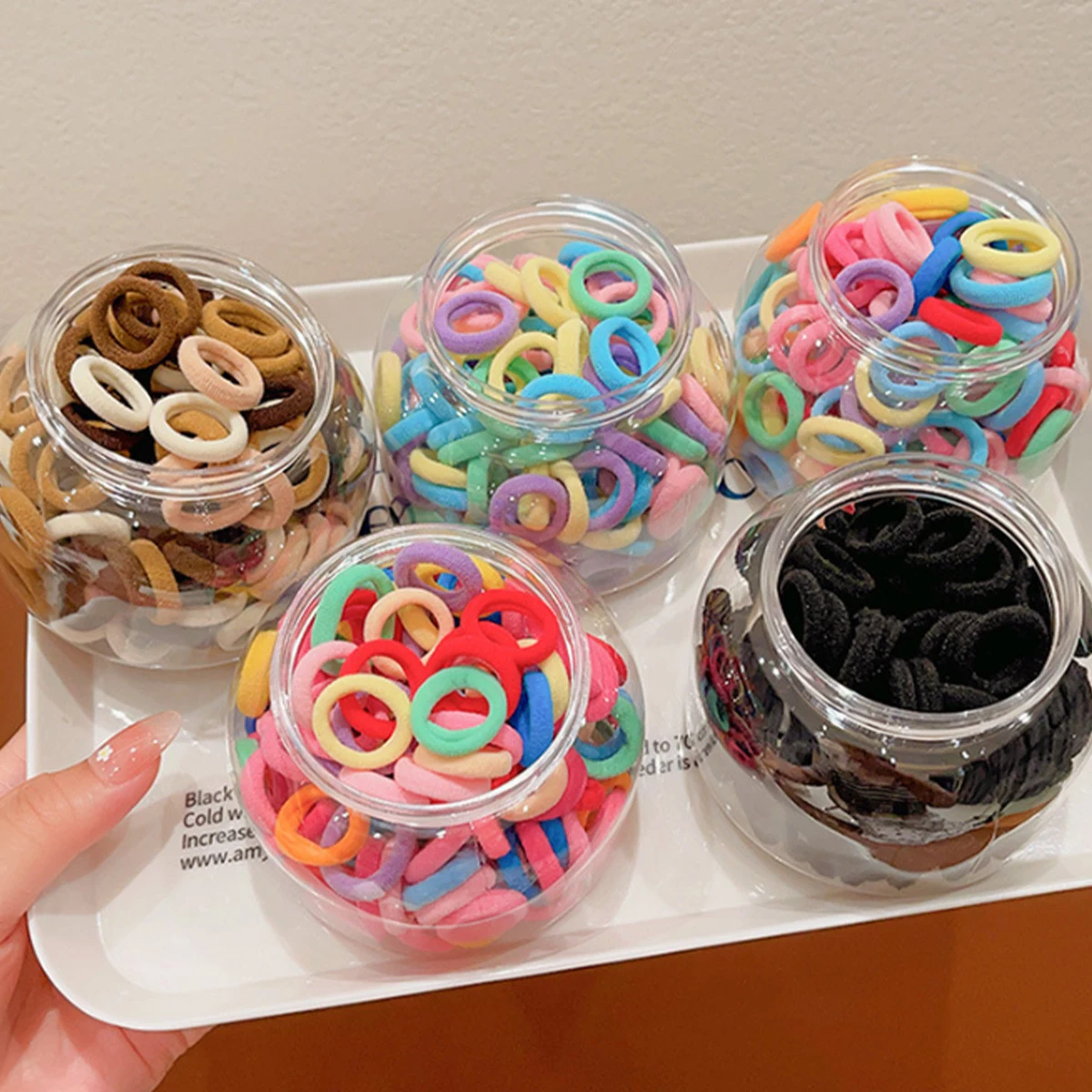 Банки из 100 шт. высокоэластичный кожаный ремешок для девочек резинка волос