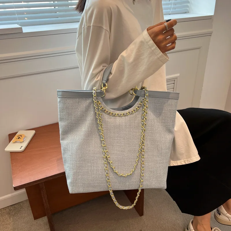 

High-quality texture hand-held ladies bag summer 2022 new trend fashion large-capacity tote bag commuting versatile shoulder bag