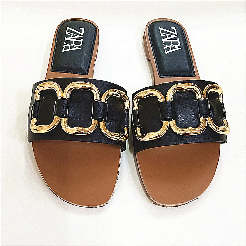 

2022 summer niche new 2022 new hollow outer wear open toe black metal decorative flat sandals for women