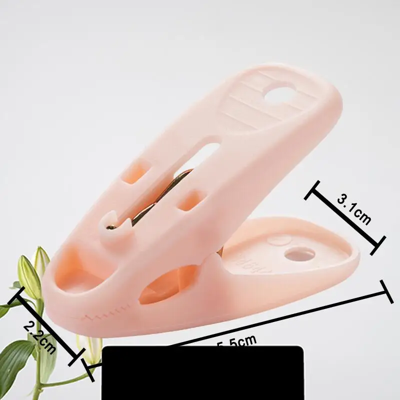 

Tea Flower Windproof Clothes Hanger Clip - Innovative Plastic Clothespin for Securely Hanging and Drying Clothes