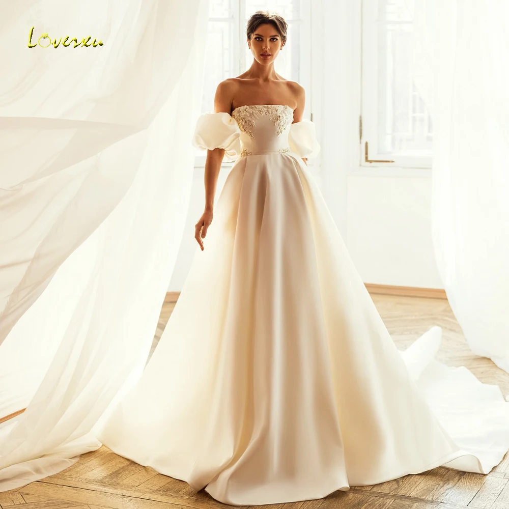 

Женское атласное свадебное платье Loverxu, матовое ТРАПЕЦИЕВИДНОЕ платье без бретелек со съемными пышными рукавами, элегантное платье с бусинами, 2023