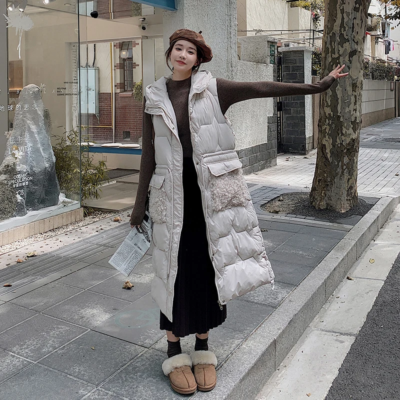 

Женский Длинный пуховой жилет без рукавов, однотонный Корейский жилет с капюшоном и подкладкой, женская модная Повседневная зимняя куртка с меховыми карманами, 2023